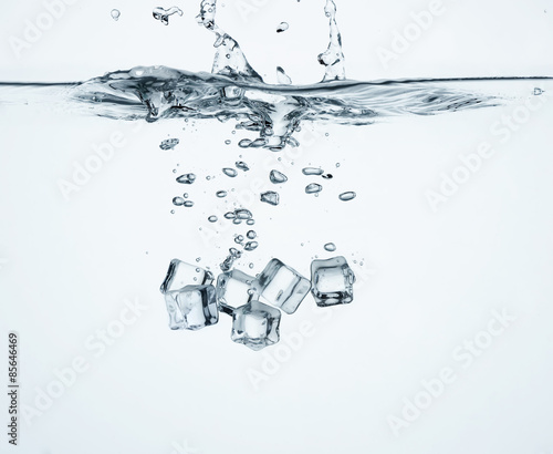 Falling ice cubes in water