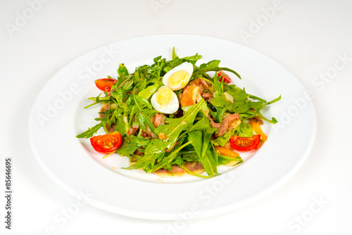 Pashot egg and salad with backed duck, rucola, cherry tomatoes