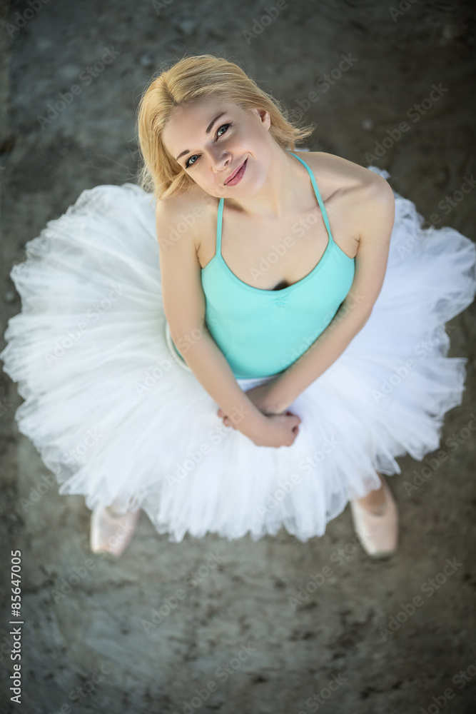 Pretty blond ballerina looking up at the camera. Pretty blond ballerina looking up at the camera.