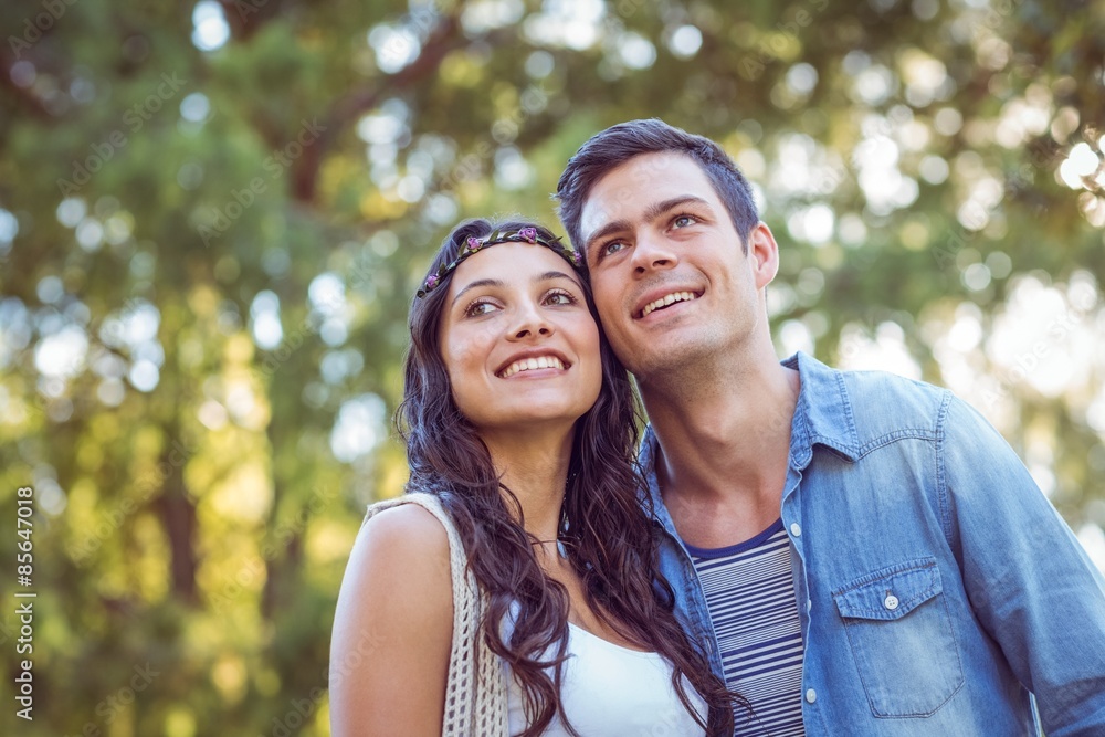 Fototapeta premium Cute couple smiling in the park