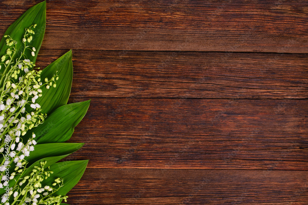 Lilies of the valley on wooden background, copy space Lilies of the valley on wooden background, copy space