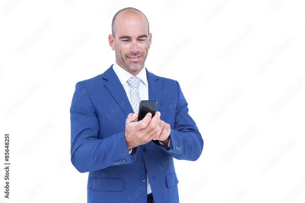 happy businessman playing with his smartphone happy businessman playing with his smartphone