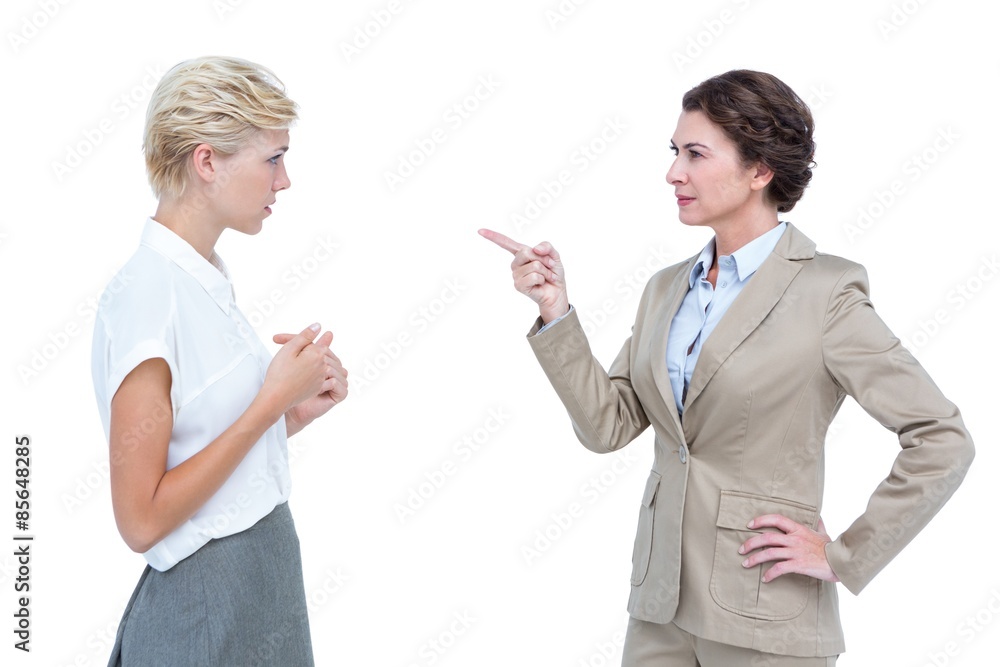 Businesswomen having a violent debate in office Businesswomen having a violent debate in office