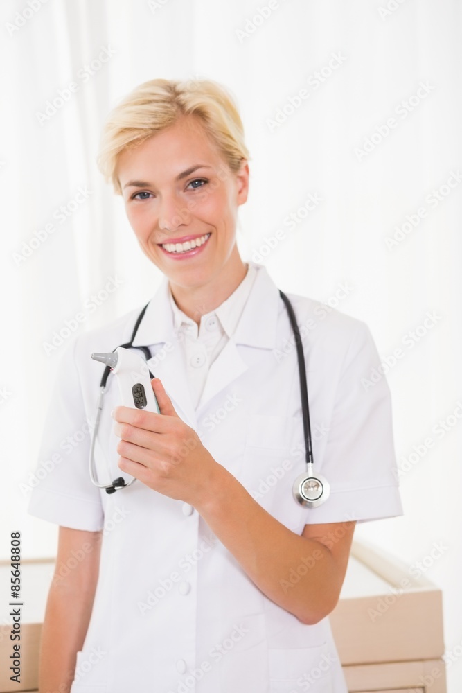 Portrait of a smiling blonde doctor with stethoscope Portrait of a smiling blonde doctor with stethoscope