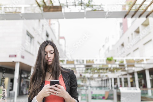 Portrait of a beautiful young businesswoman standing outside usi photo