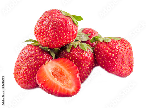 Red strawberries with green leaves, isolated