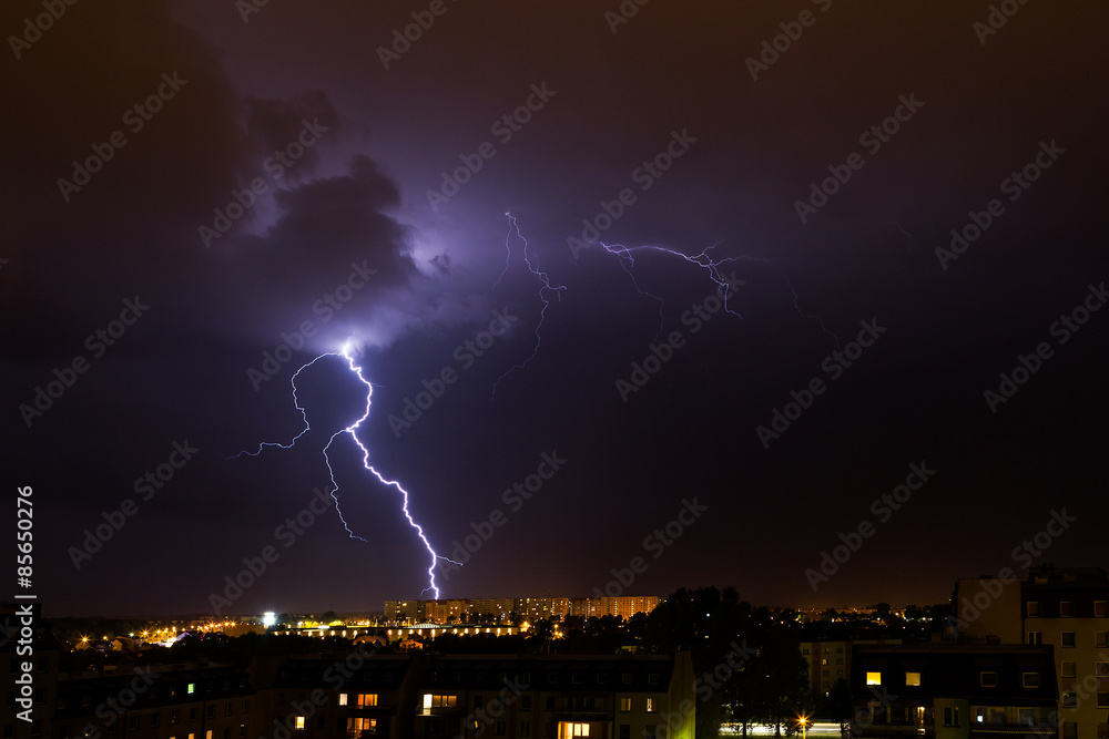 Lightning storm over city.