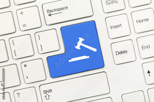 White conceptual keyboard - Blue key with gavel symbol