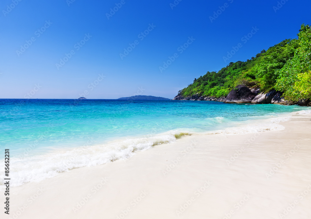 Tropical white sand beach arainst blue sky. Similan islands, Tha