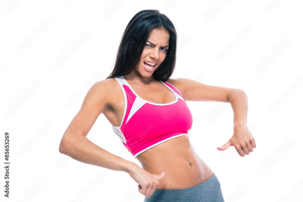 Fototapeta premium Fitness woman showing finger at her belly