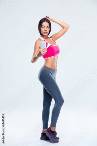 Fitness woman making selfie photo on smartphone © Drobot Dean