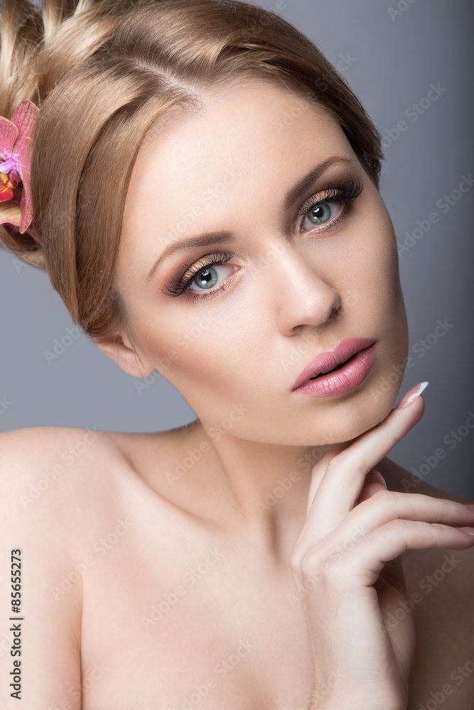 Portrait of a beautiful woman in the image of the bride with flowers in her hair. Picture taken in the studio on a black background Portrait of a beautiful woman in the image of the bride with flowers in her hair. Picture taken in the studio on a black background