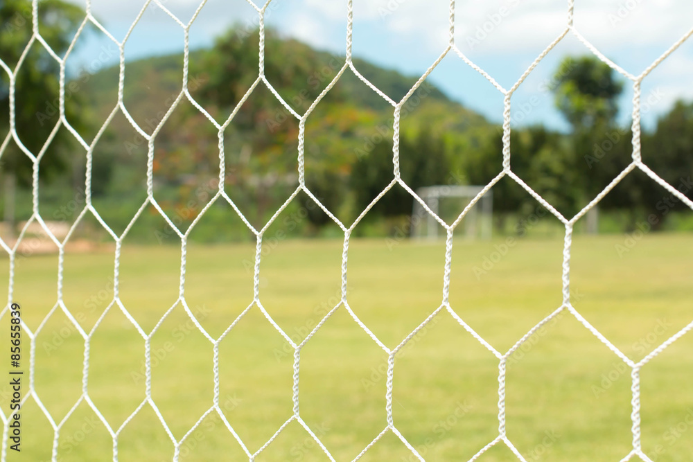 soccer net on green grass soccer net on green grass