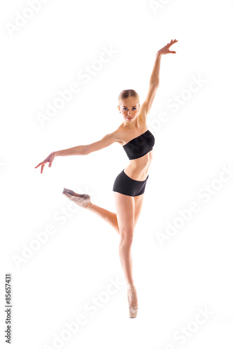 ballerina posing in studio on white background