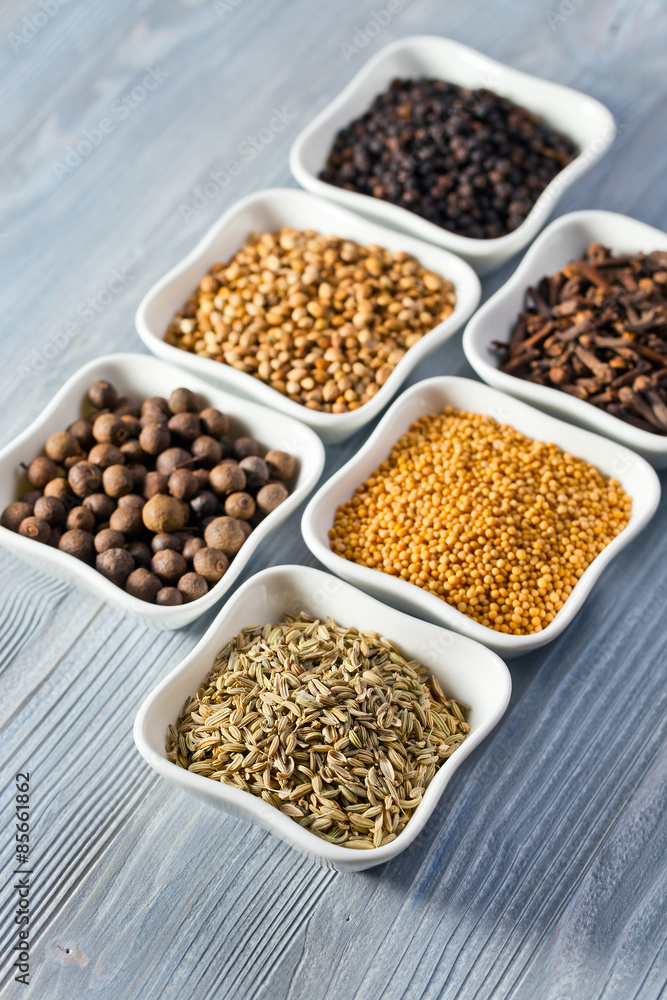 spices in small ceramic cups