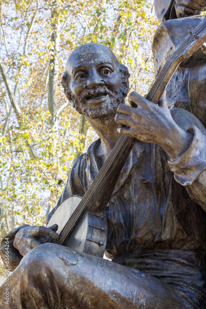 Banjo Man - Bronze Statue of Elderly Bald Bearded Man Playing the Banjo