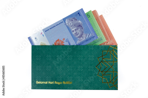 'Duit Raya' is money given from adult to children during Eid al-Fitr celebration in Malaysia. This is a Malay tradition and regarded as alms to the children.