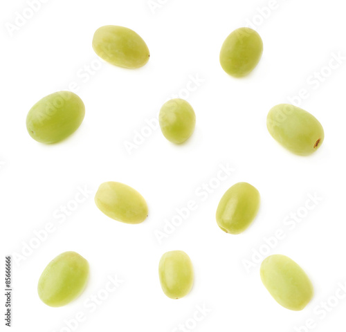 Five single white grapes isolated