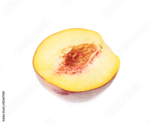 Half of a peach fruit isolated