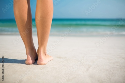 Feet of woman at the beach