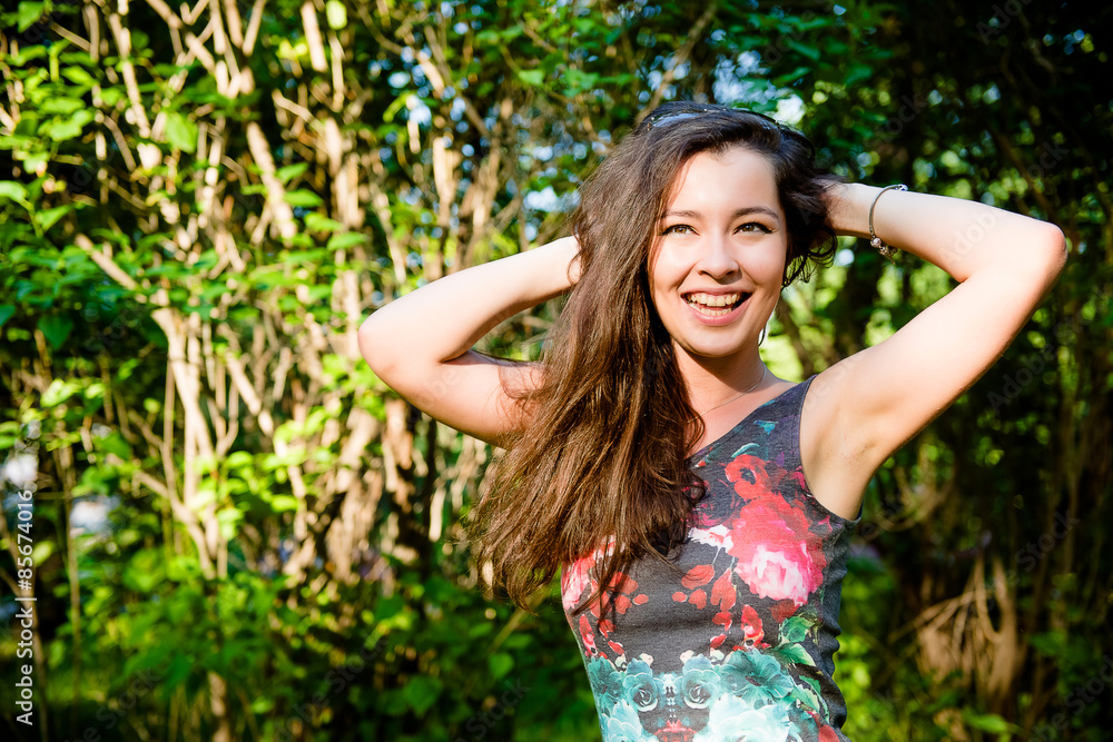 Smiling young woman outdoors in sunglasses Smiling young woman outdoors in sunglasses