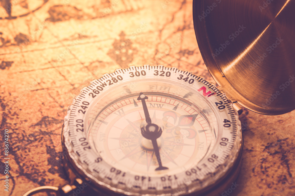 Compass on vintage map.