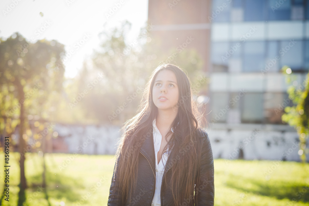 Fototapeta premium young beautiful long hair woman in town
