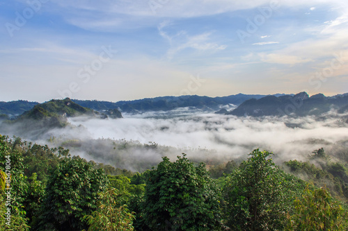 Layer of mountains in the mist at sunrise time, Baan Nai Wong, Ranong Province, Thailand