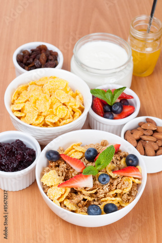 bowl of cornflakes with fresh berries and breakfast cereals