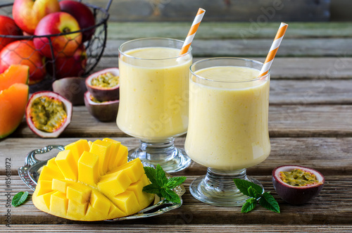 Tropical mango and passion fruit smoothie for healthy breakfast #85681872