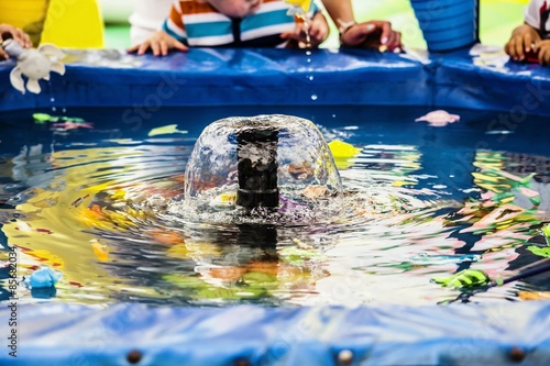 game for children in the park to catch in the water with the help of rods floating child's toy