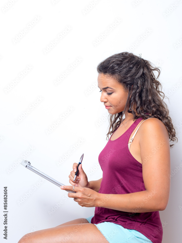 Young Lady Reviewing Paperwork Young Lady Reviewing Paperwork