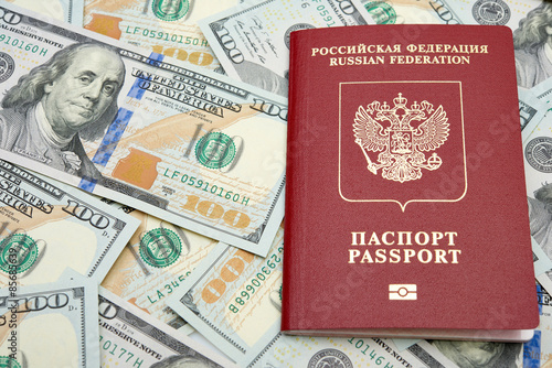 Russian passport with American dollars