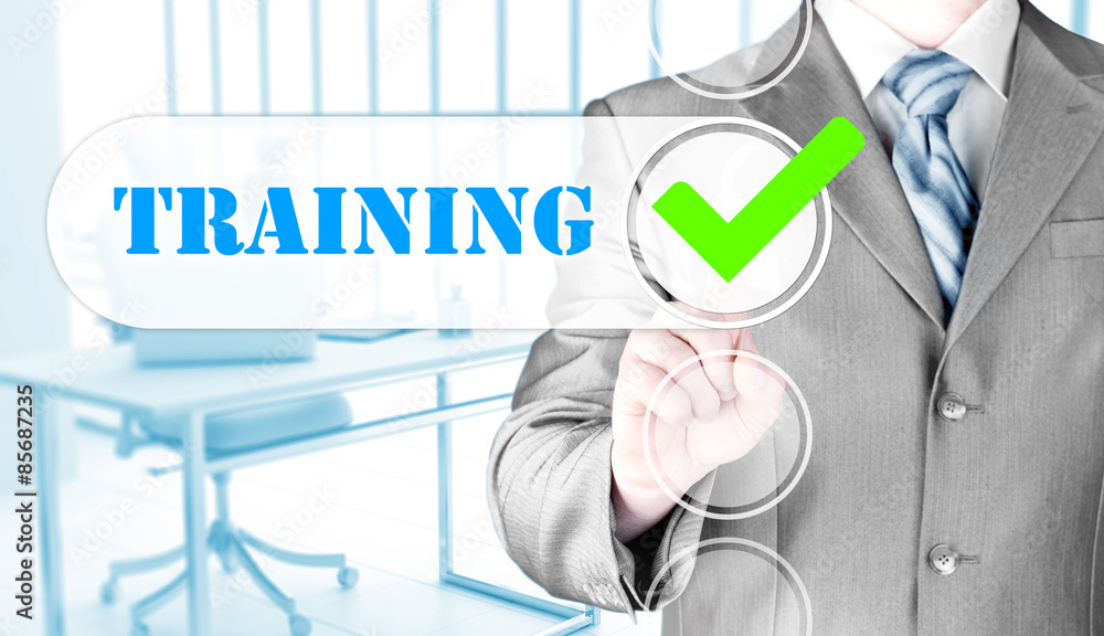 Businessman pressing touch screen interface training checkbox