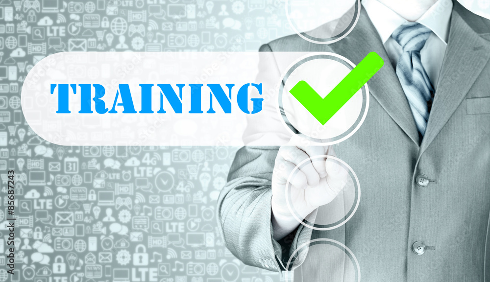 Businessman pressing touch screen interface training checkbox Businessman pressing touch screen interface training checkbox