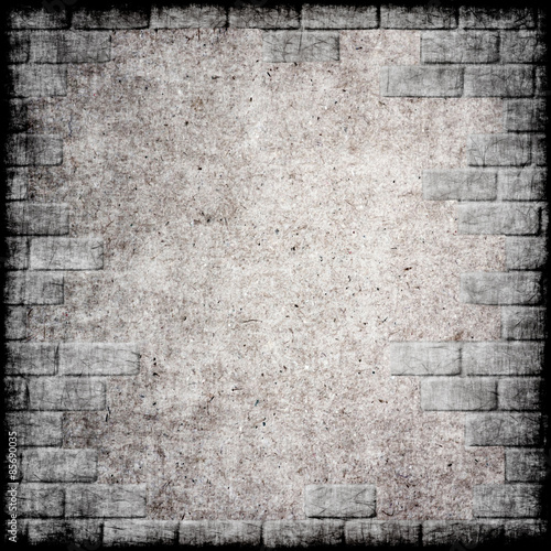 Abstract monochrome grunge background with brick frame.