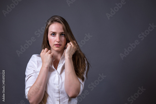 Tablou pe pânză Young Woman Wearing White Button-up Shirt