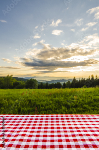 Empty table with landscape background