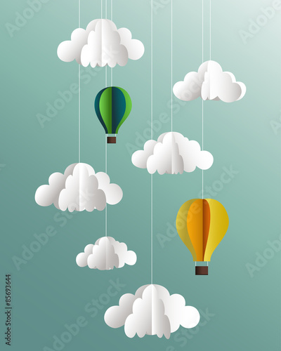 Paper clouds and balloons on blue background