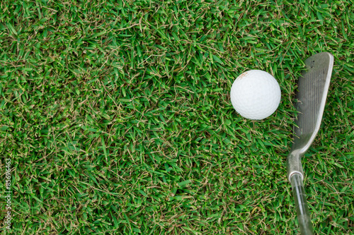 Golf Ball and Golf Club on grass