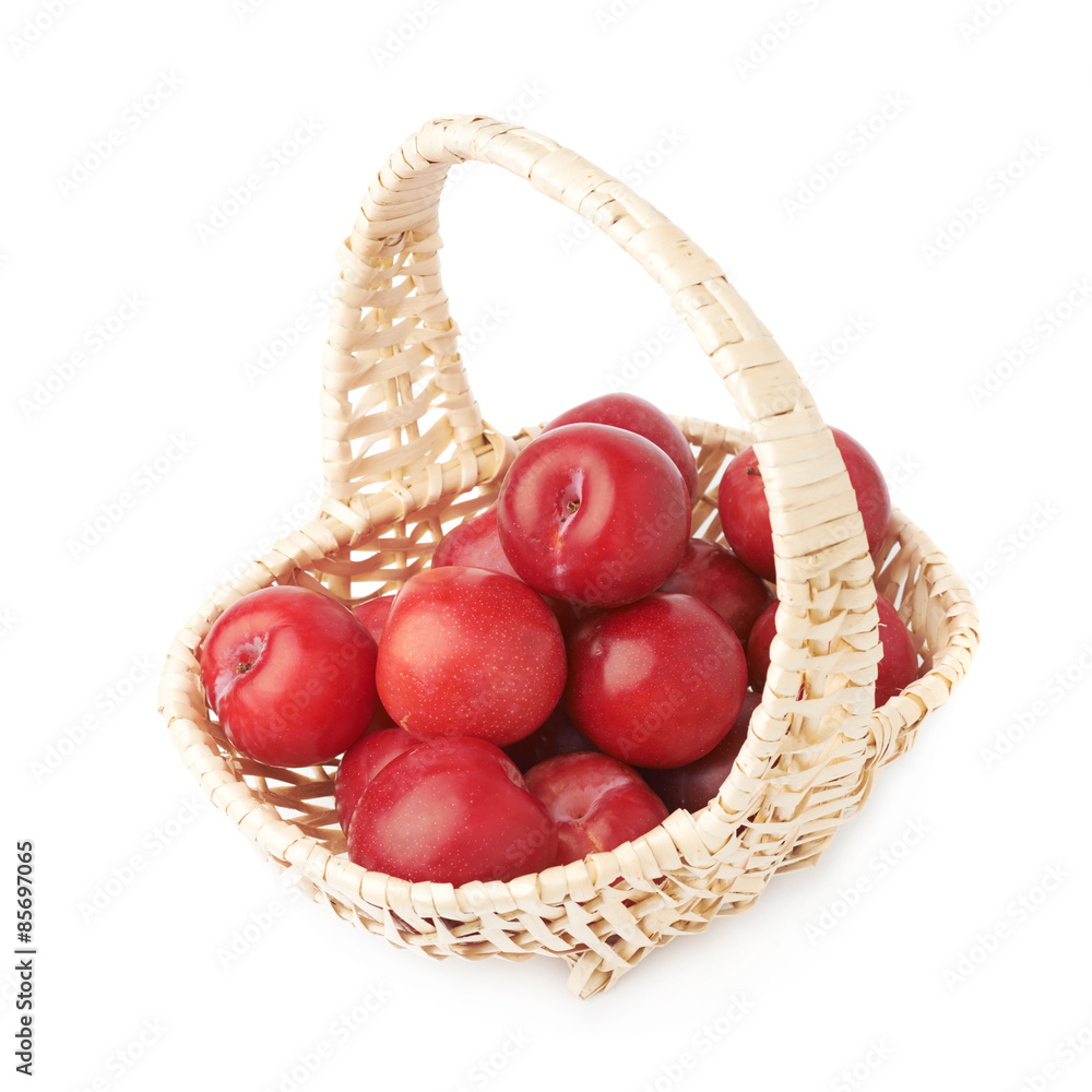Wicker basked filled with plums Wicker basked filled with plums
