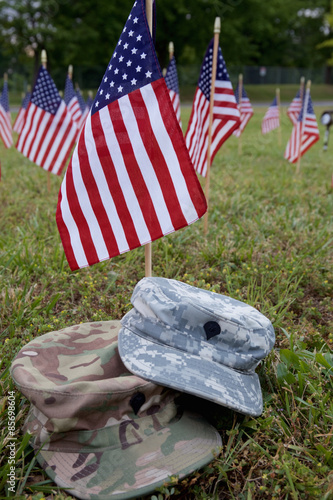 Military cap and american flags