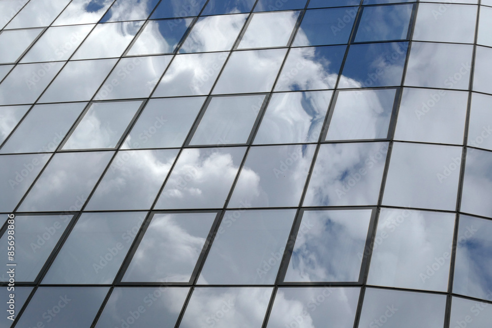 Fototapeta premium Reflection in windows of modern office building