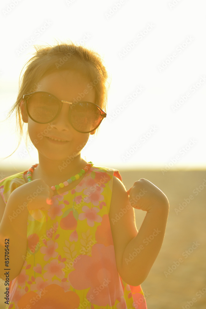 Defocused and blurred image Child kid posing and fun on the beac Defocused and blurred image Child kid posing and fun on the beac