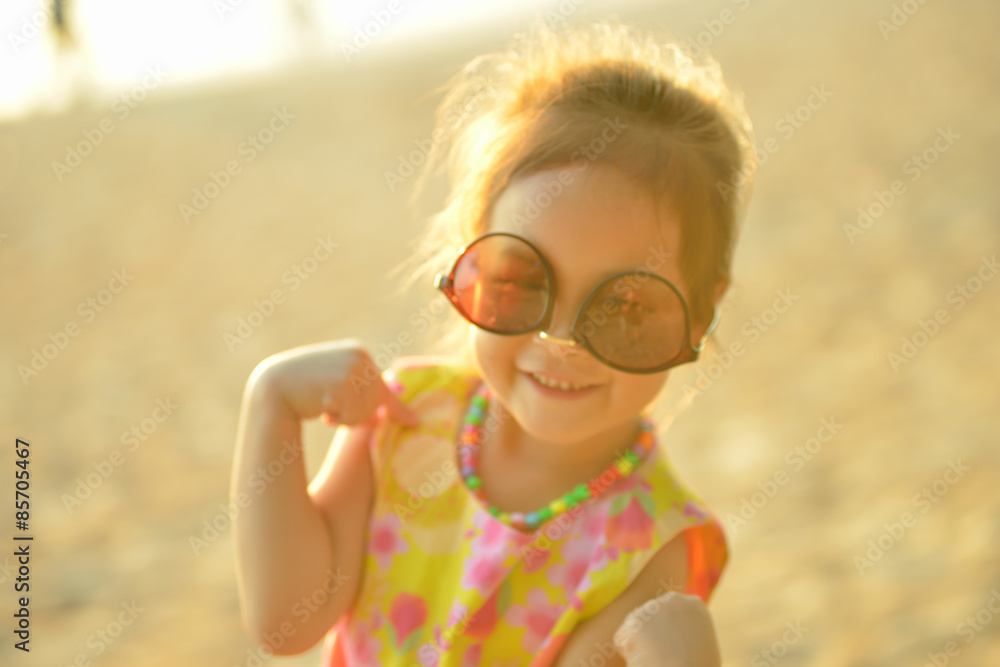 Defocused and blurred image Child kid posing and fun on the beac Defocused and blurred image Child kid posing and fun on the beac