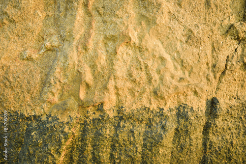 Texture of stone with golden sunset light © teen00000