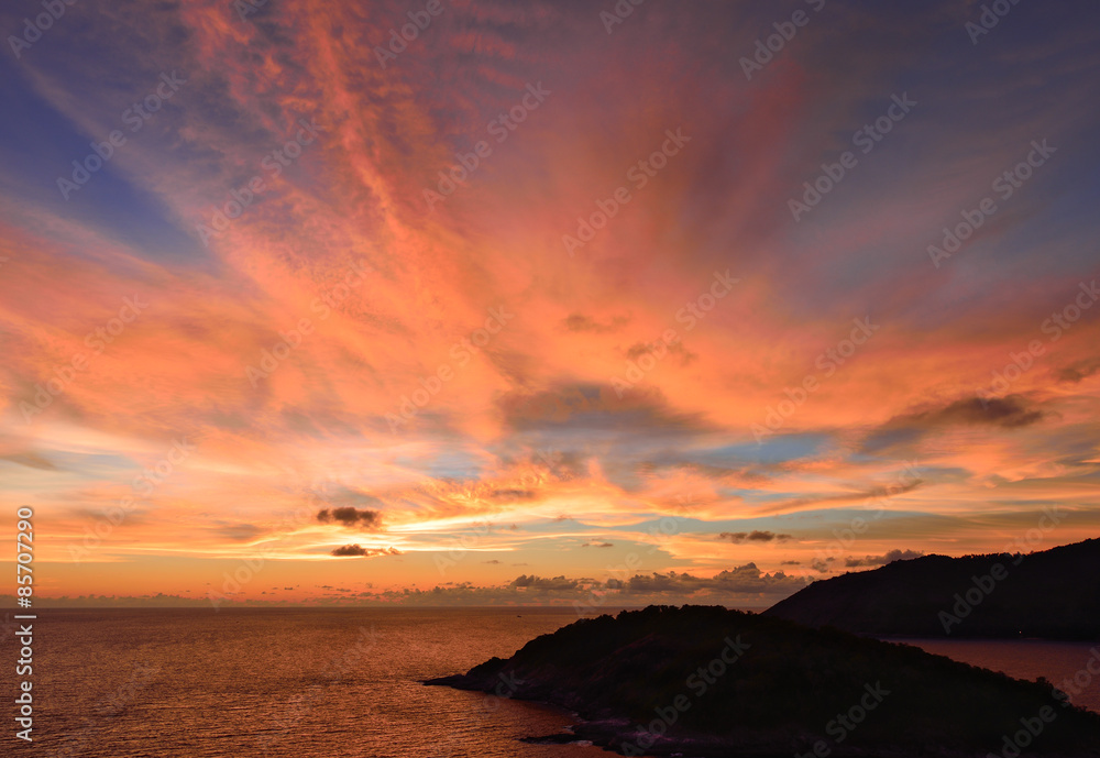 Sunset sky with pink clouds explosion after sunset on the ocean