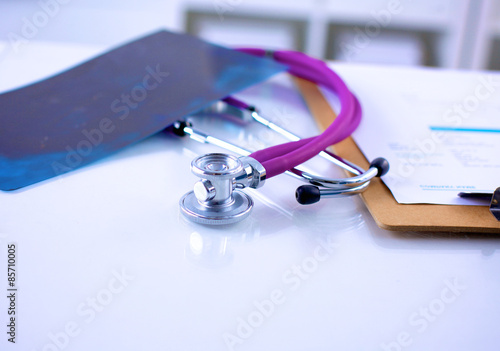 Doctor&amp;amp;amp;#39;s stethoscope  with folder on the photo