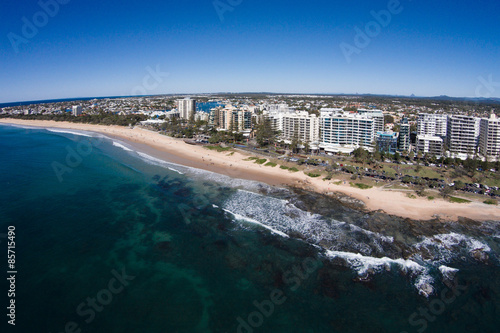 Aerial view of beachfront hotels on sunrise