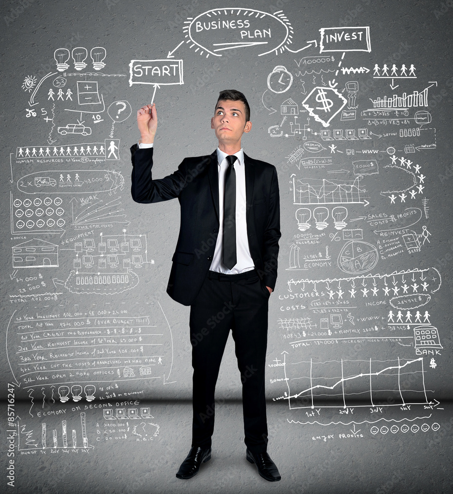 Man writing business plan Man writing business plan